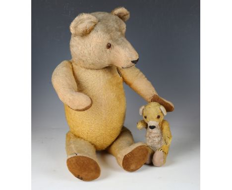 A mid-20th century mohair teddy bear with amber and black eyes, stitched snout and jointed body, height 60cm, and another ted