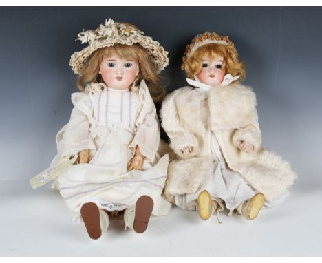 An Armand Marseille bisque head doll, impressed '390 2', with blonde wig, sleeping brown eyes, open mouth showing upper teeth