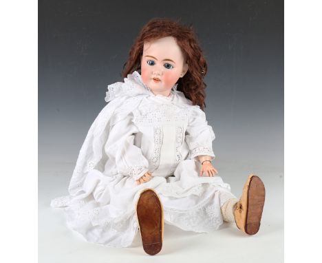 A Pierre Muller Olympia bisque head doll with brown wig, card pate, sleeping eyes, pierced ears, open mouth showing upper tee