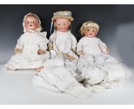 Four Armand Marseille bisque head baby dolls, each with painted moulded hair, sleeping eyes, open mouths showing upper teeth 