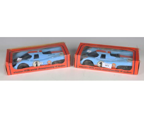 Two Pocher plastic winners of the 1970 International Championship for Makes Porsche 917 racing cars in Gulf livery, both boxe