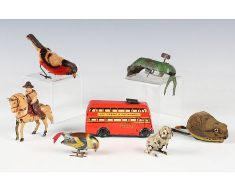 A small collection of clockwork toys, comprising Wells Brimtoy trolley bus, two birds, frog, beetle, begging dog and horse an