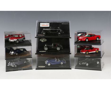 Nine Vitesse 1:43 scale model cars, including Chevrolet Corvette, Jaguar XK8 coupé and Lotus Elise, all within plastic displa