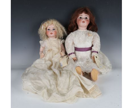 A Schoenau &amp; Hoffmeister bisque head doll, impressed '1909 7½', with later brown wig, sleeping brown eyes, open mouth sho