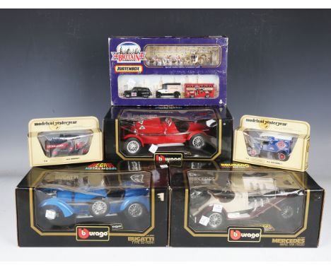 A collection of diecast vehicles, including three Bburago 1:18 scale cars, Matchbox and Corgi buses and commercial vehicles a