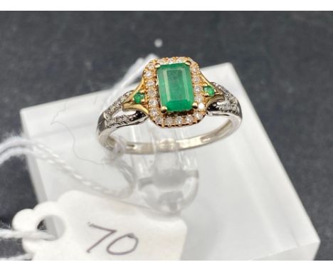 An unusual gold &amp; silver emerald and diamond ring with diamond shoulders size L ½