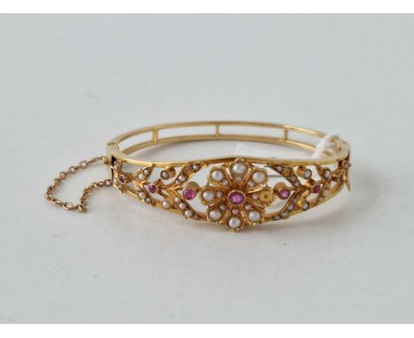 A RUBY AND PEARL BANGLE SOME PEARLS MISSING 18CT GOLD 14.9 GMS