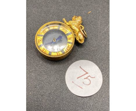 A round compass fob with lion finial 4.9 gms  