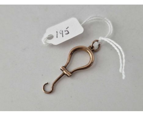 A unmarked gold button hook charm 1.4 gms