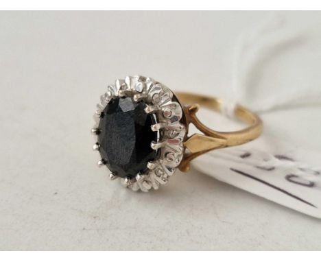 A sapphire and diamond cluster ring 9ct size P 4.3 gms