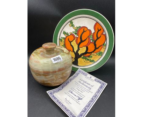 A Clarice Cliff plate with CIA and a turned Onyx jar and cover