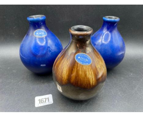 A pair of Blue Ground Poole vases onion shaped with labels, 5" high