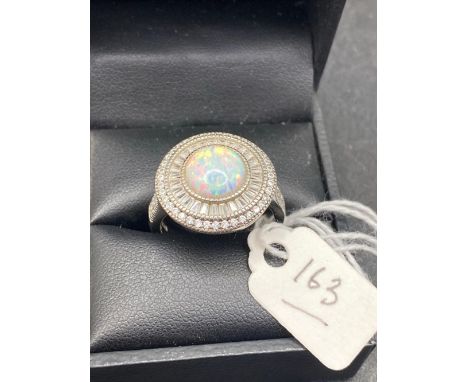A fine circular statement opal ring in silver size Q 8g