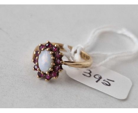 A opal and garnet ring misshaped 9ct size M 2.4 gms