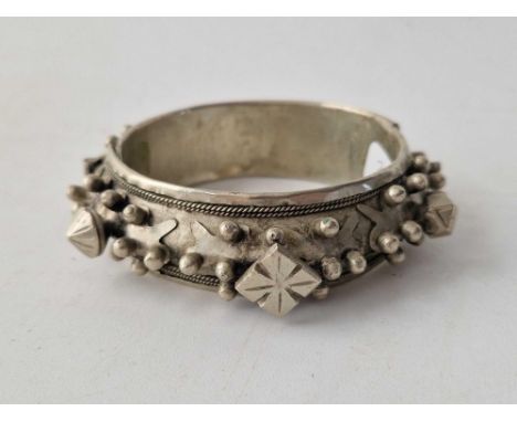 A very large white metal fancy cuff bangle