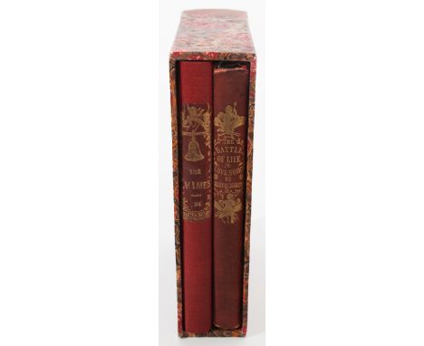 These are two volumes of first edition Christmas books by Dickens in a custom-fitted slipcase. The first is The Chimes: A Gob