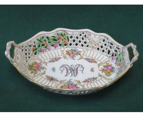 DRESDEN HANDPAINTED AND GILDED FLORAL DECORATED TWO HANDLED PIERCEWORK OVAL CERAMIC BASKET 