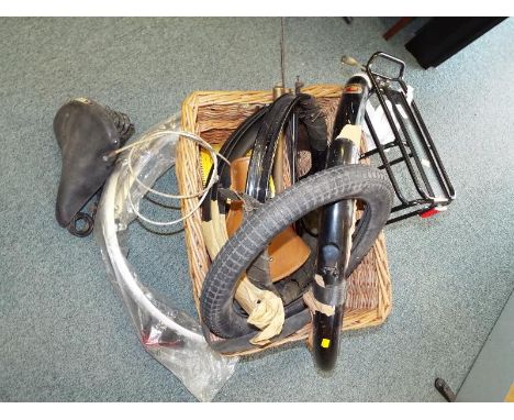 A collection of predominately vintage bike accessories to include Phillips mudguards, vintage bells, Dunlop seats, tyres and 