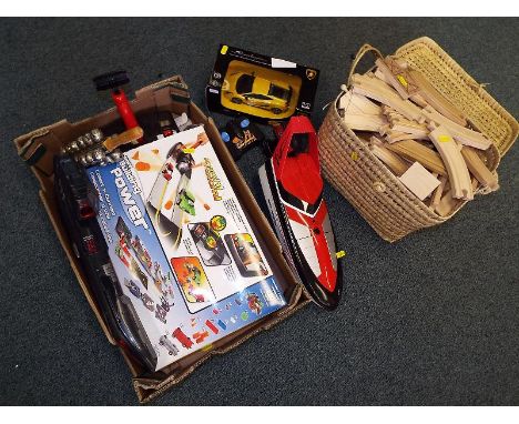 A mixed lot to include a Lamborghini  Superleggera diecast model vehicle, boxed, Tyco R/C sea arrow boat, wooden track and ot