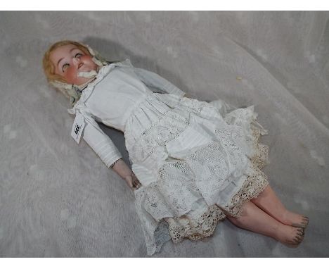 An Armand Marseille bisque headed doll with jointed limbs sleeping eyes open mouth showing teeth marked 370AM -2 1/2- DEP