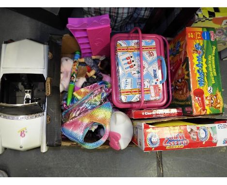 A good mixed lot of toys to include some board games, a novelty handbag, a large Bratz convertible car, miniature figures wit