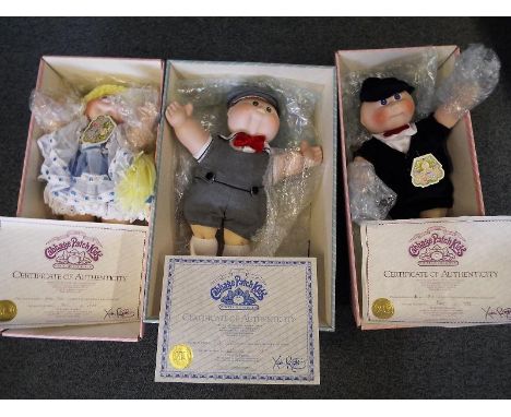 Three Cabbage Patch dolls by Applause from the porcelain collection to include Geoffrey Nicholas, Kellyn Marie and Timothy Da