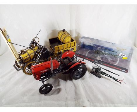 A mixed lot to include a Stevensons Rocket Engine, Massey Ferguson model tractor, a Corgi Helicopter Legends Augusta Bell mod