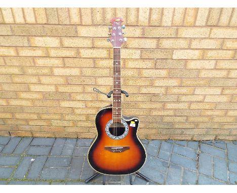 A Tanglewood Odyssey electro acoustic guitar, bowl back - estimate £30 - £50