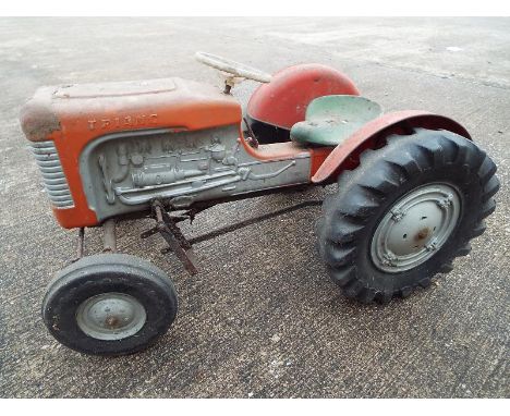 A child's pedal operated Tri-ang Tractor based on a Massey Ferguson - Est £50 - £80
