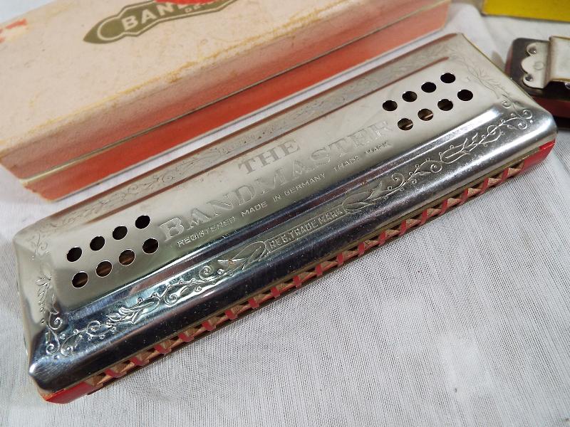 A The Bandmaster chromatic harmonica made in Germany with original box and a Bugle Band Artist Co