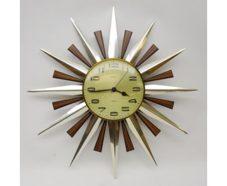 1960s/ 70s Metamec Quartz Sunburst wall clock, Arabic numerals with chromed and faux rosewood mounts, D60cm  Condition Report