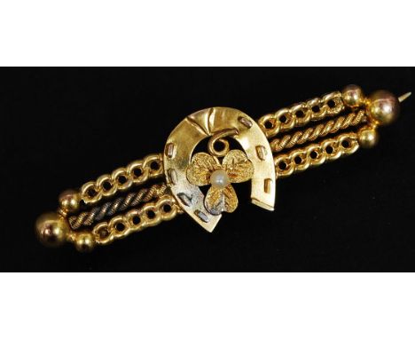 A 9ct gold bar brooch with central horseshoe and clover motif set with  a seed pearl. Total weight 3.3g.

FREE UK POSTAGE ON 