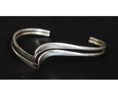 A 20th century contemporary twin swirl wishbone bangle - bracelet. Stamped 925.

FREE UK POSTAGE ON ALL LOTS INCLUDING COMBIN