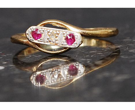 An 18ct gold ruby and diamond ring. The 3 channel set stones with central 1pnt diamond. Total weight 2.0g. Size R

FREE UK PO