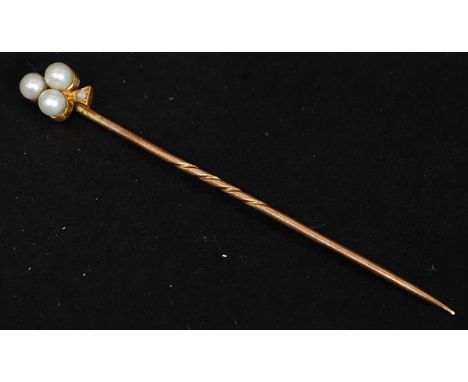 A 15 ct gold, diamond and seed pearl ( club and diamond style ) stick pin - hat pin. The diamond approx 1pnt. Total weight 1.