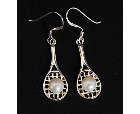 A pair of silver and pearl earrings in the form of tennis rackets and ball. Total weight 2.9g

FREE UK POSTAGE ON ALL LOTS IN