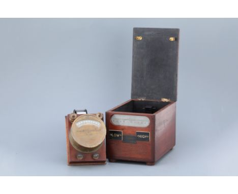 including a reflecting galvanometer in a mahogany case, and a volt/amp meter on a mahogany base