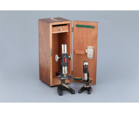 including a model 3 student microscope in the original card case and another microscope by Cotopus in a card case