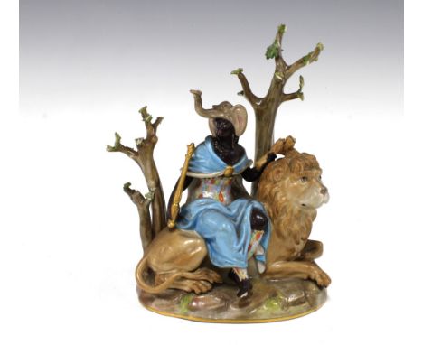 Meissen allegorical figure group representing Africa from the Four Continents series, with blue crossed swords mark and impre