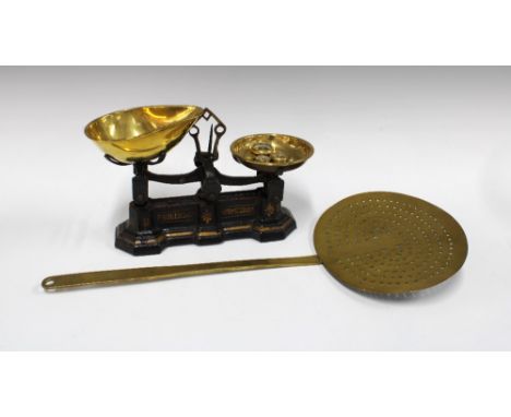 Cast iron and brass scales, P. Rogers &amp; Co. Birmingham, 30 x 17cm, together with a brass strainer 54cm (2)