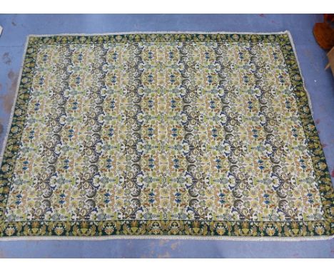 A large tapestry style wool rug with allover foliate pattern,&nbsp;295 x 400cm