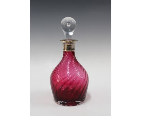 Cranberry glass decanter with a silver collar and clear glass stopper, Birmingham 2002, 29cm