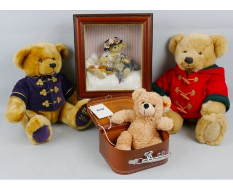 A modern Steiff soft plush teddy bear, in simulated leather suitcase box 28cm high, two Harrods teddy bears for 2000 with pur