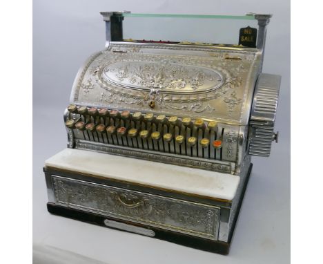 An American National cash register, early 20th century, by The National Cash Register Company, the chromium plated case embos
