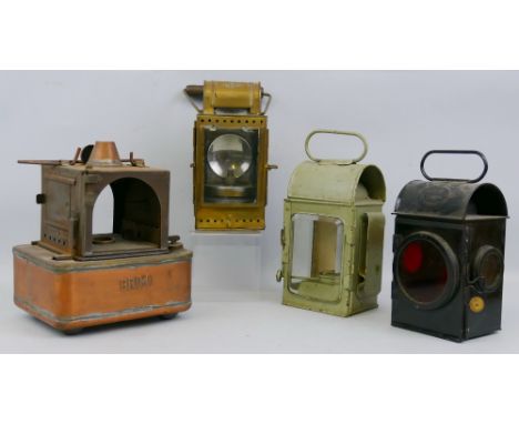 An Osmeka German railroad signal lamp, brass cased with clear, green and red glass panels, carbide burner and wooden swing ha