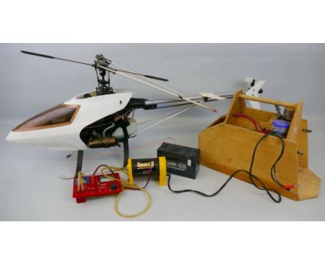 A radio controlled Nitro Helicopter Kyosho Nexus, with starter pack and some tools, 117cm long, rotor diameter 122cm