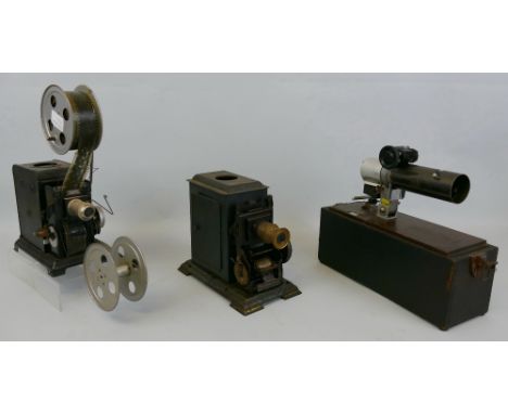 Three unusual projectors, a hand-cranked tinplate 35mm cine projector, marked with "L" and "M" in a circle to each side and c