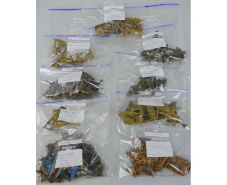 A quantity of various scale plastic and die-cast model soldiers, predominantly in WWII uniforms, by Crescent, Lone Star, Henl