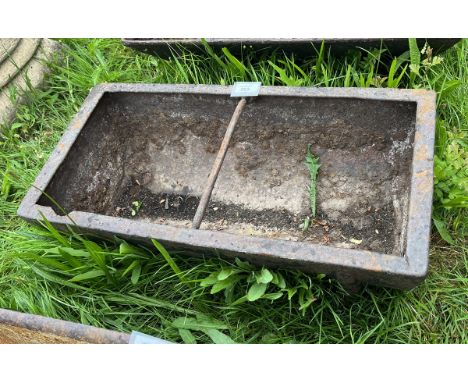 Small antique cast iron feeding trough