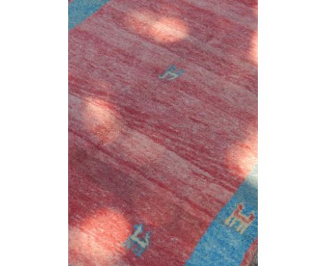 A Shiraz (Gabb Tribe) rug, light red ground, 175cm x 117cm.